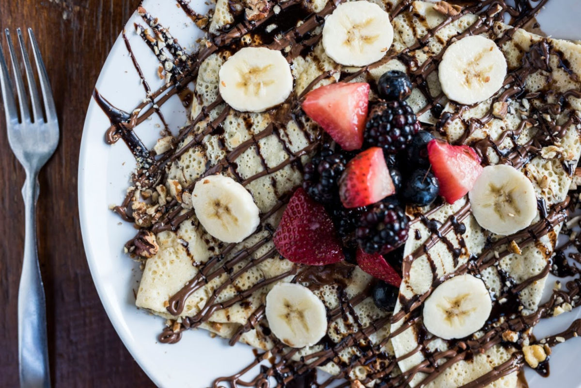 Pancakes with fruit and chocolate topping